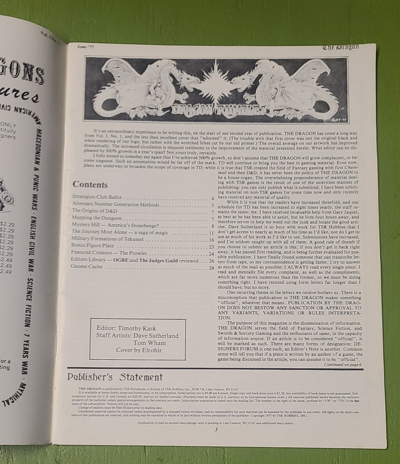 Open book with text and illustrations on a green surface